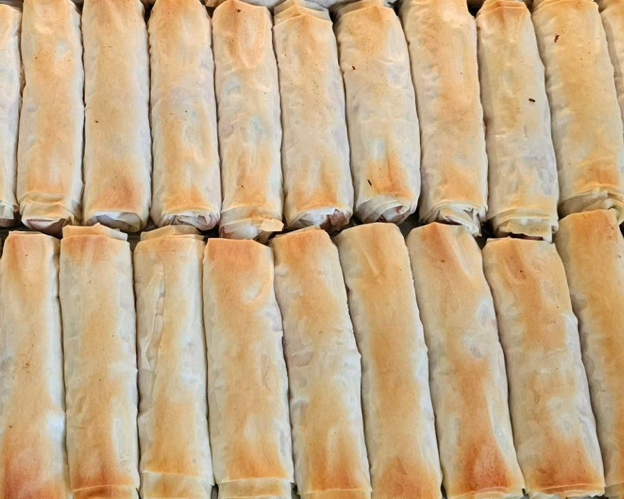 Traditional Middle Eastern chicken rolls served warm